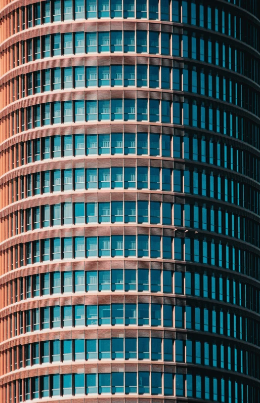 the top half of a building with a circular window