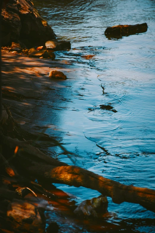 an ocean view with blue water and rocks