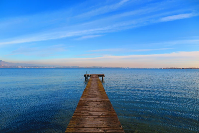 a long pier extending out to a body of water