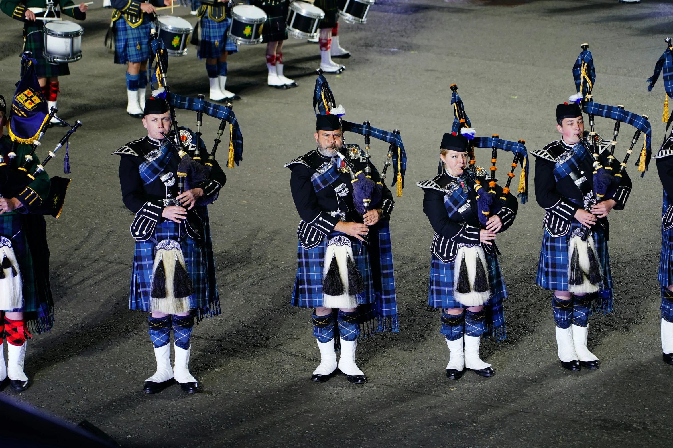 a large group of men playing in a parade