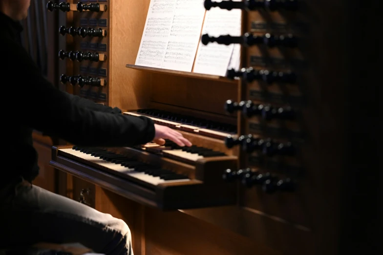 a person playing the organ with its hands