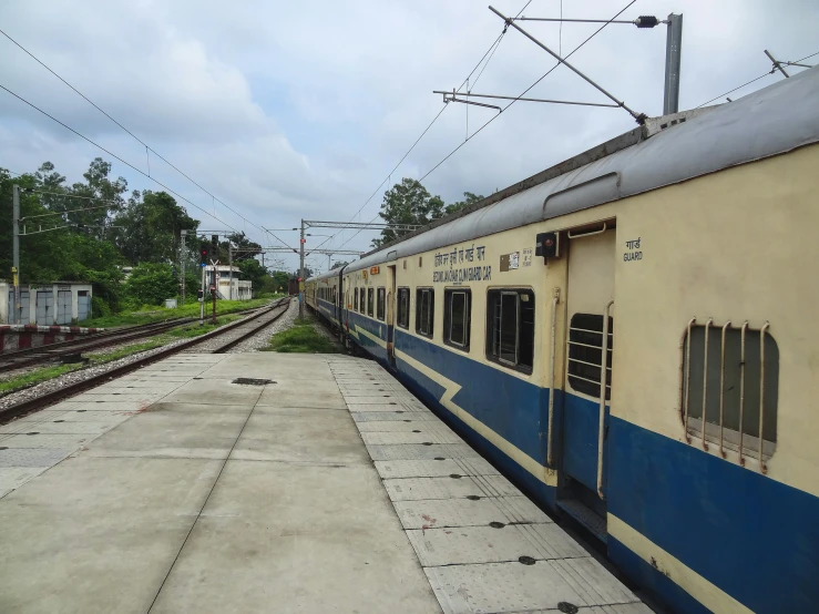 a train on a track next to a platform