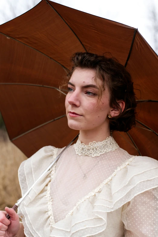 a woman holding an umbrella over her head