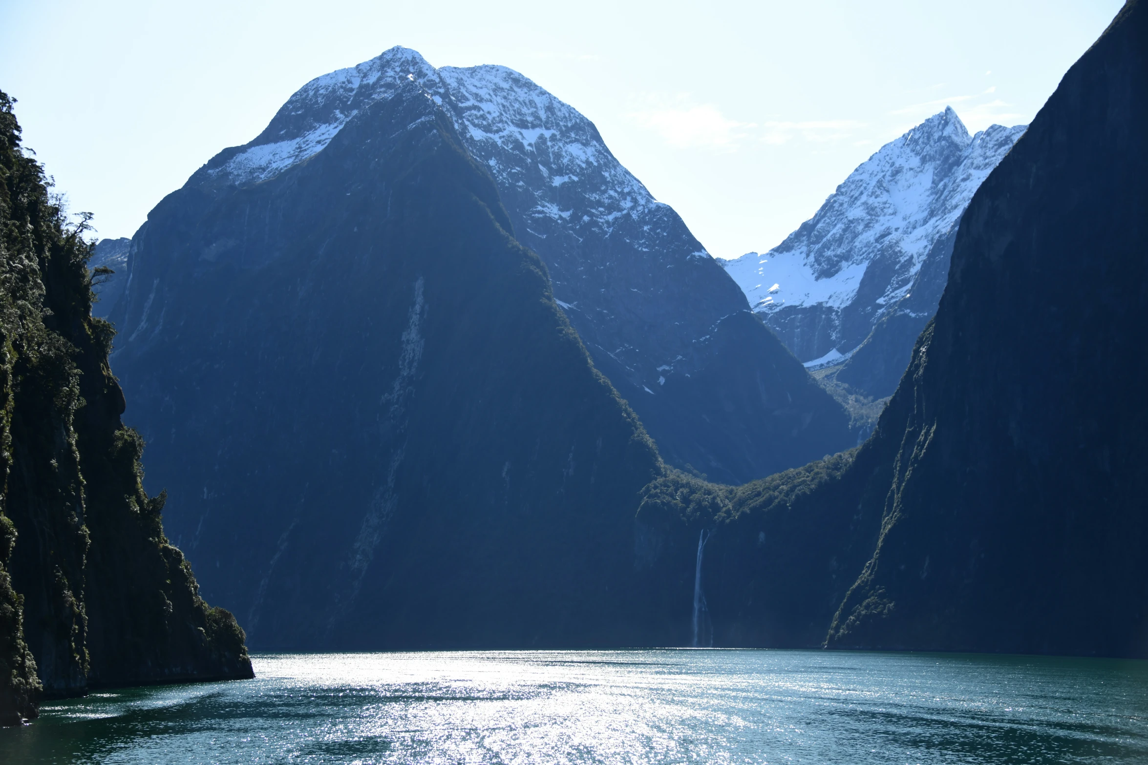 two large mountains with small lake below it