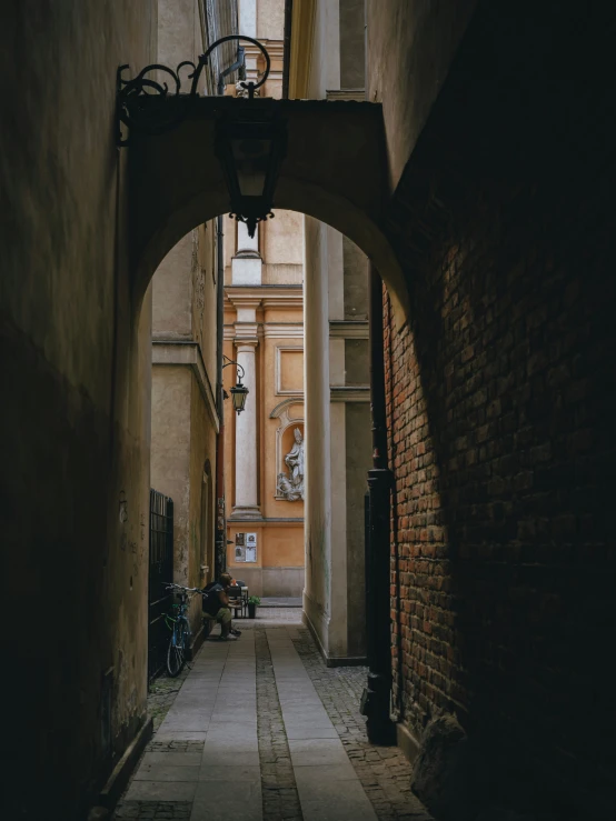 an alleyway with light, lamps and decorations