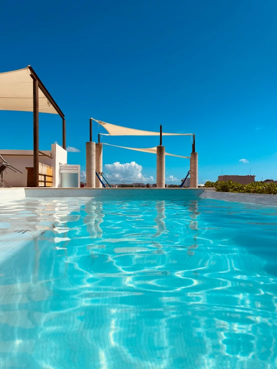 a swimming pool with a volleyball net next to it