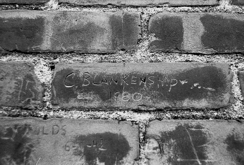 writing on the brick wall reads, change is everywhere