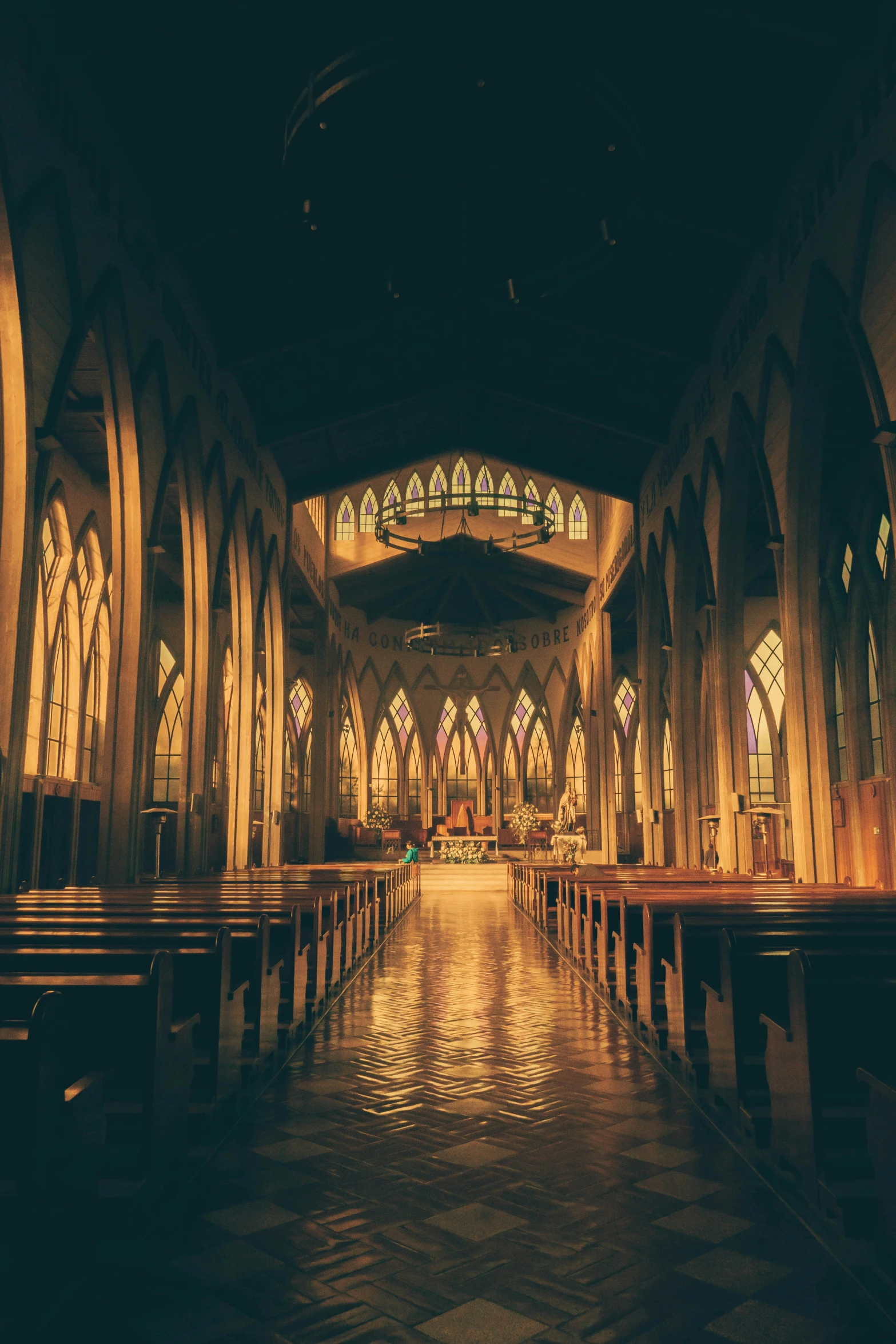 the large interior of a cathedral lit up at night