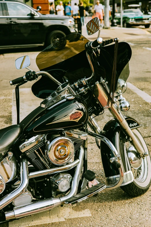 a shiny silver motorcycle sitting on a street corner