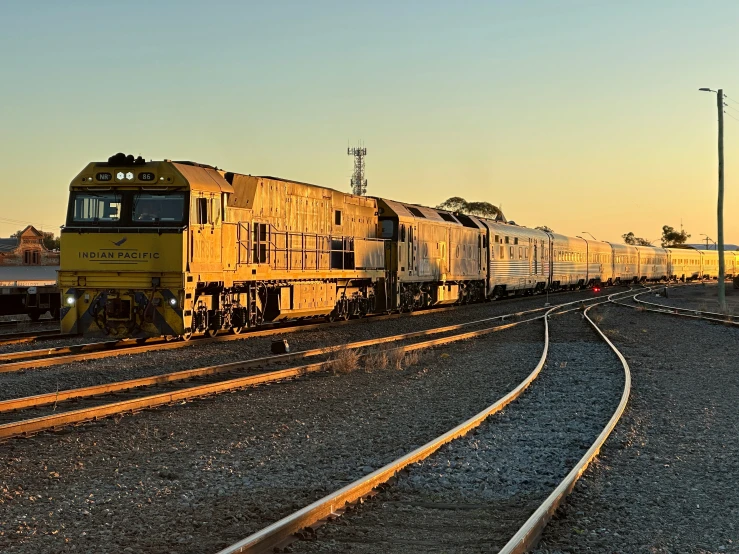 a large long train on a steel track