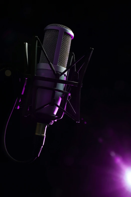 a microphone with purple light shines brightly