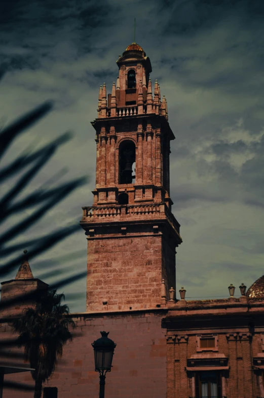 a tall brick building with a clock on it