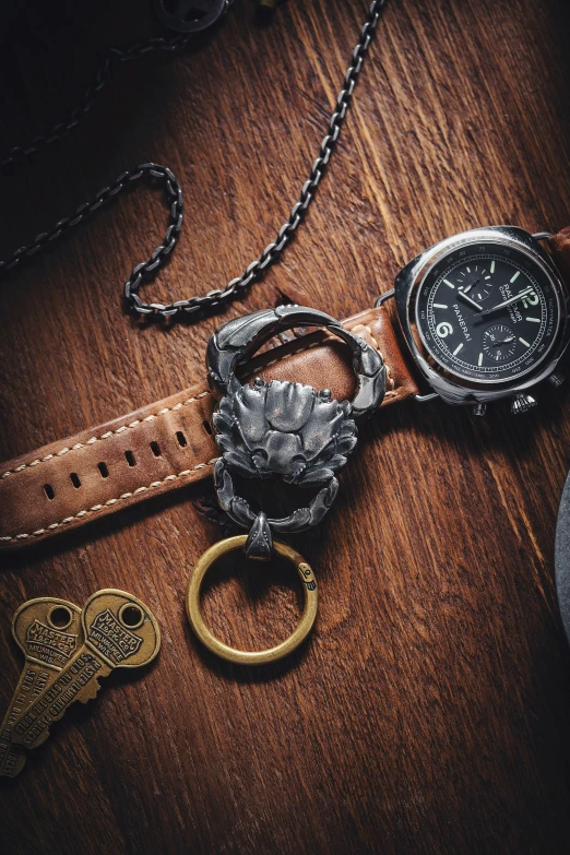 a watch and two  that are resting on top of a wooden table