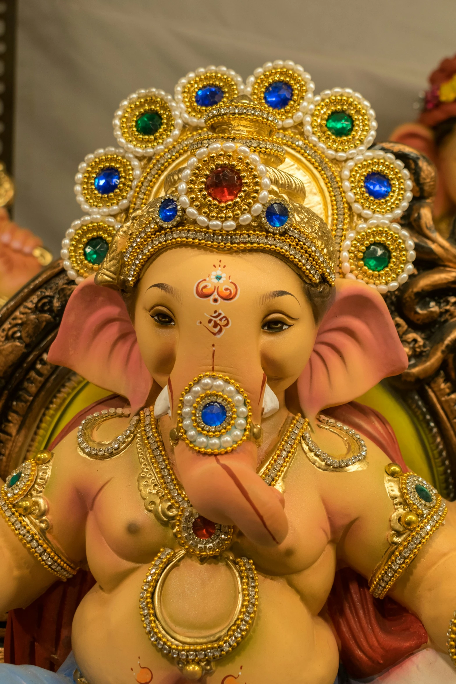 a close up of an elephant statue with a face