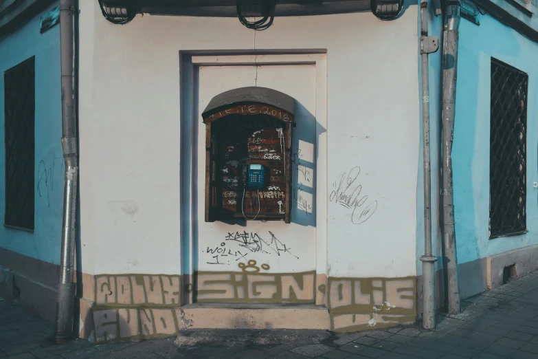 a door sits open in front of a colorful building