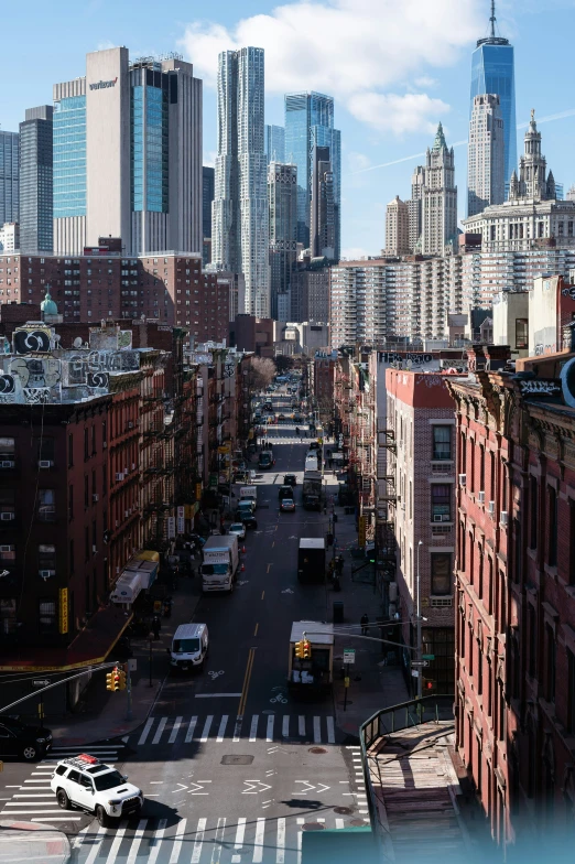 a city street with tall buildings and lots of traffic