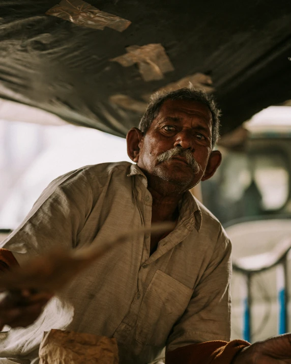 an older man has a lot of food in his hand