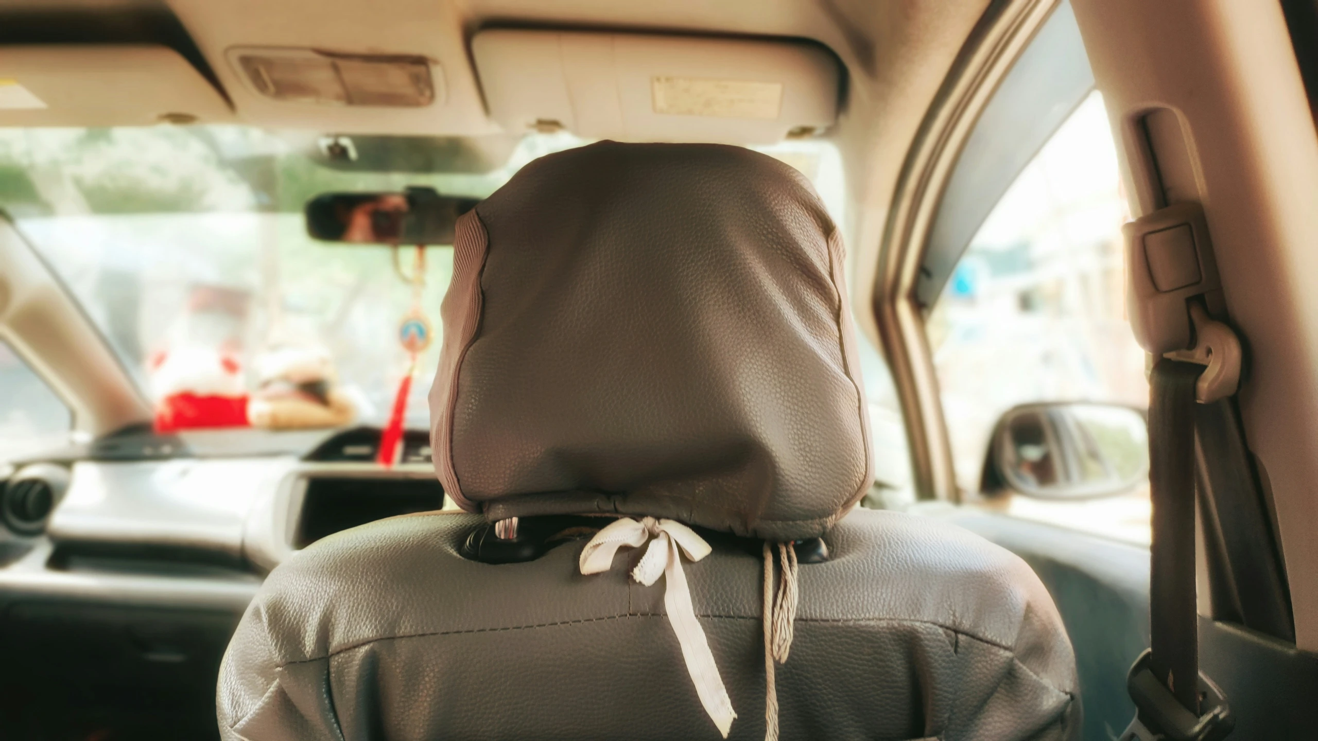 the inside of a vehicle with the front seat folded up