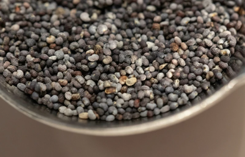 several different kinds of gray mustard in a bowl