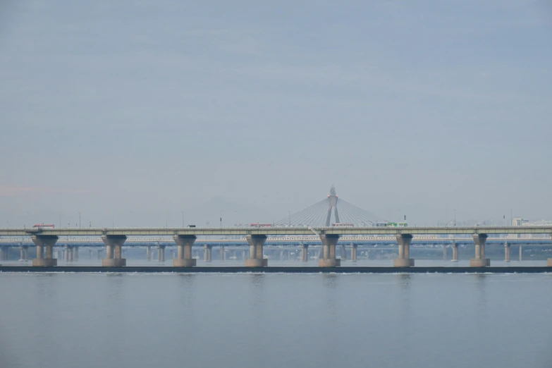 a road bridge spans across a large body of water