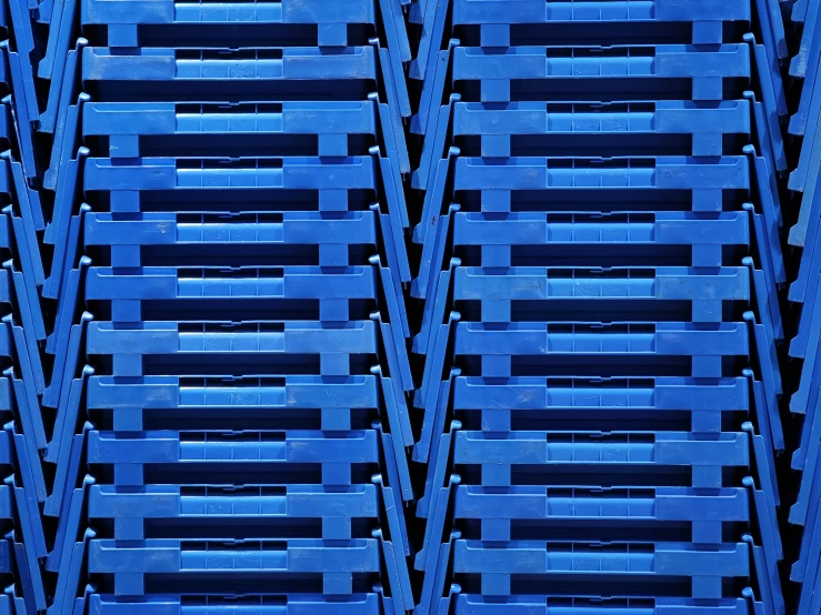 rows of crates in a storage area, lit by the blue light