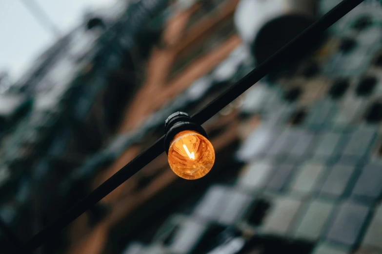 a light bulb that is hanging from a pole