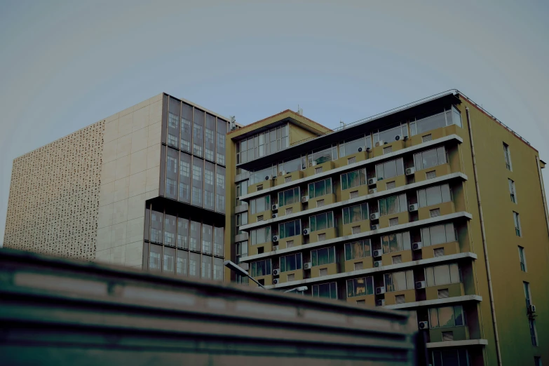 three brown and beige buildings side by side