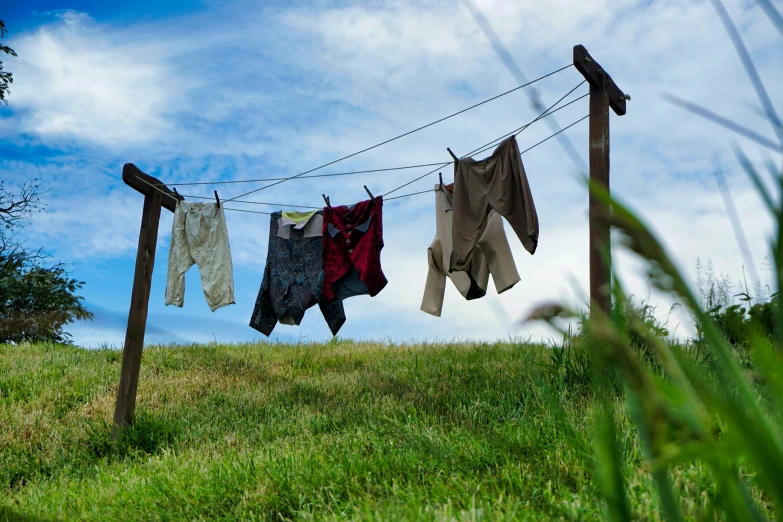 a clothesline in the sun and some washing on a clothes line