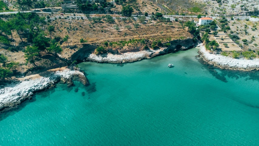 an aerial view of the water and land