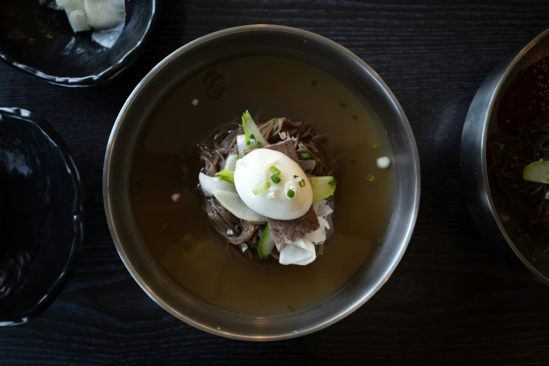 a dish of food with a bowl on the table