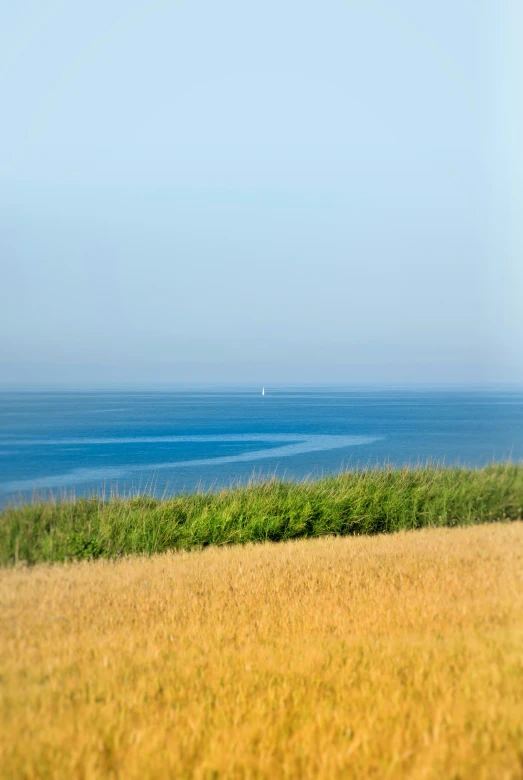 a lone boat sitting on a large body of water