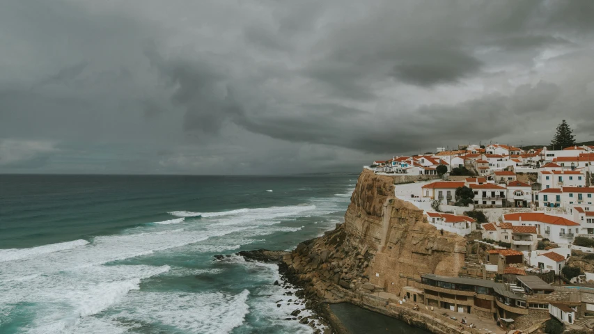 the coast of a cliff overlooks an industrial area