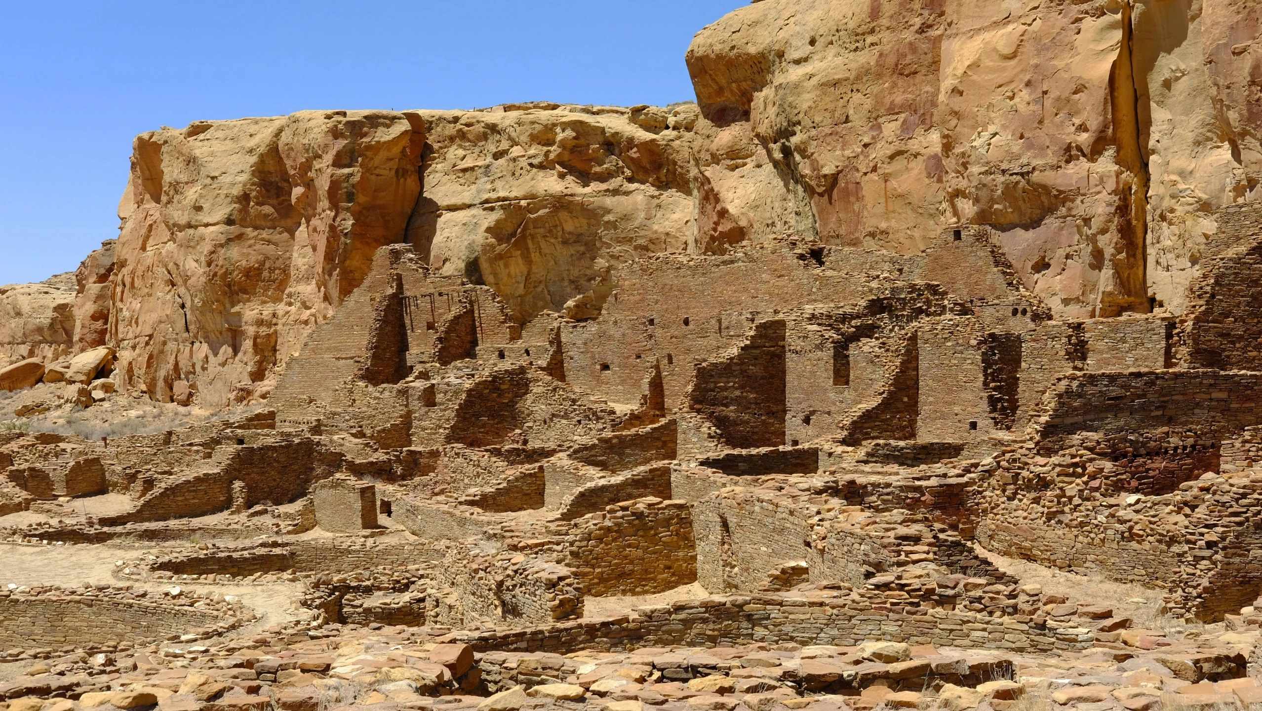 the desert has many mounds and rocks near it