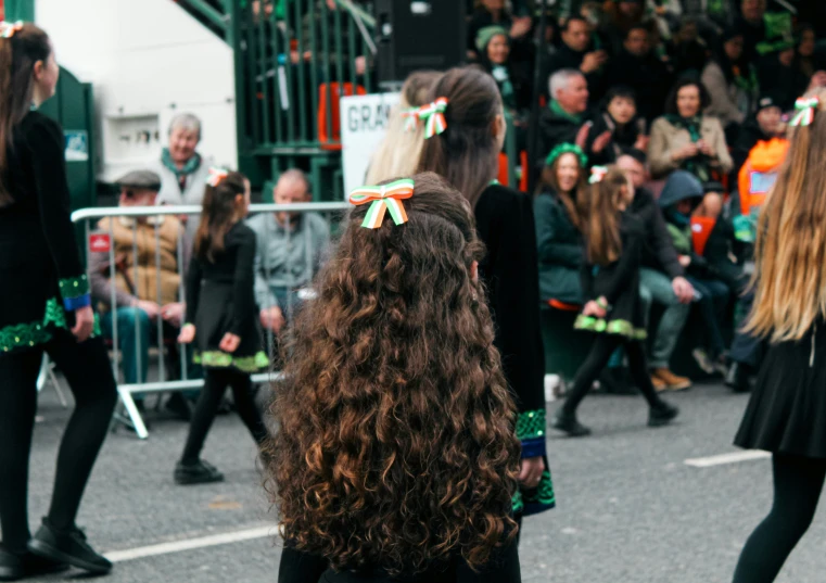 young people dancing at an event in a parade