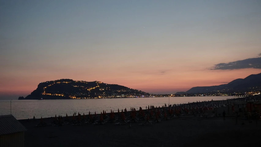 the view at night on the beach of a village