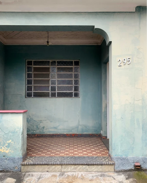 there is an open door in this small blue building