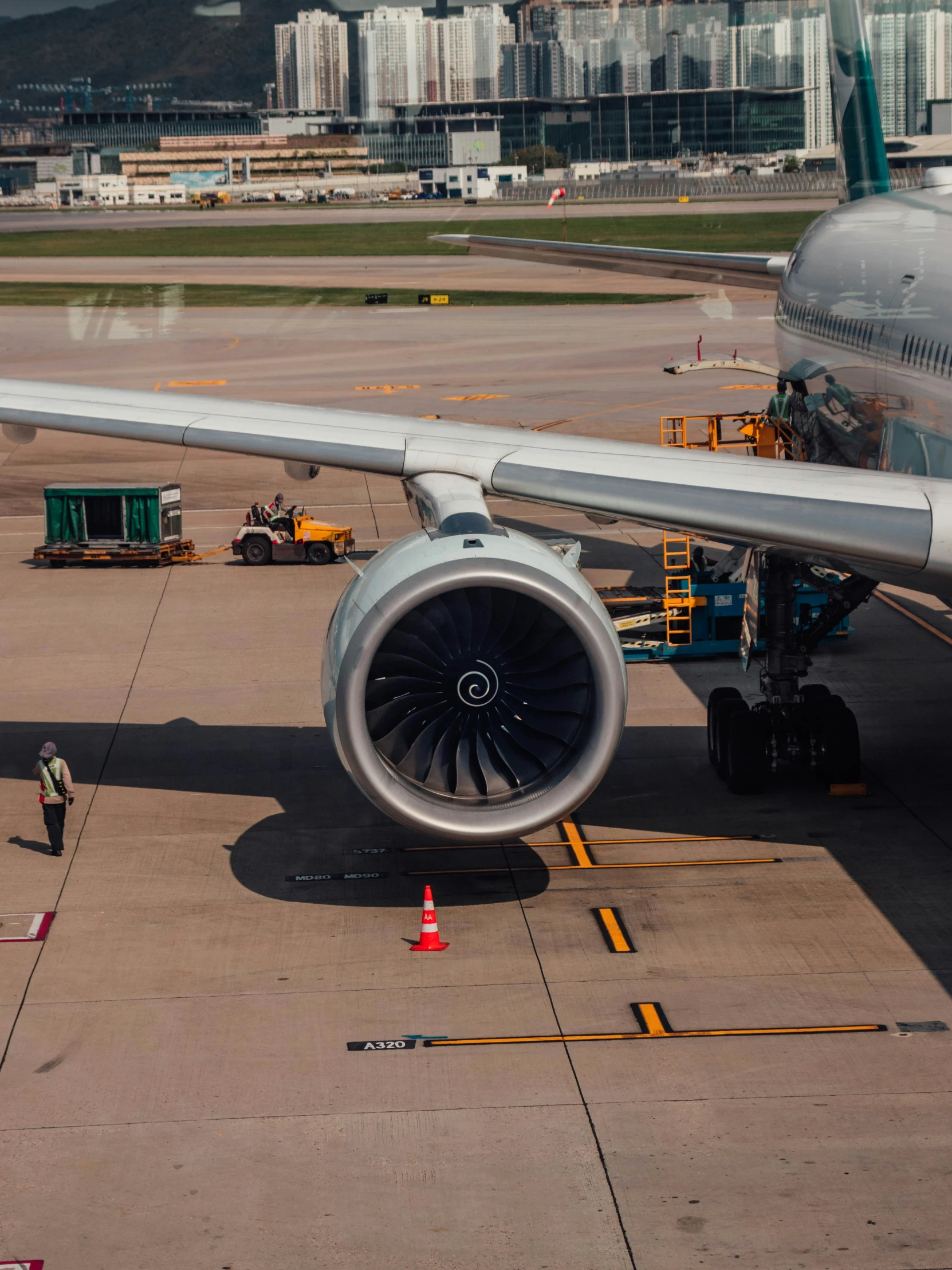 an airplane parked at the airport with a ramp attached to it