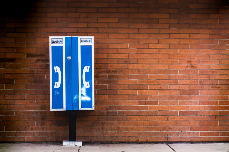 the meter is attached to a brick wall