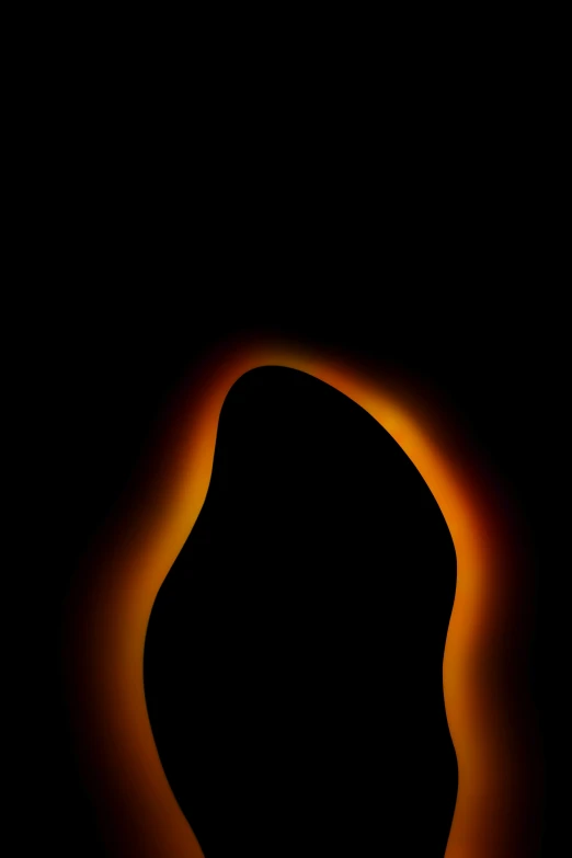 a black background with a yellow fire in it