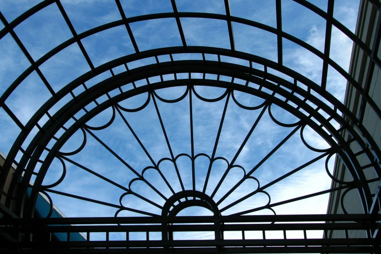 the sky and fence as seen from underneath