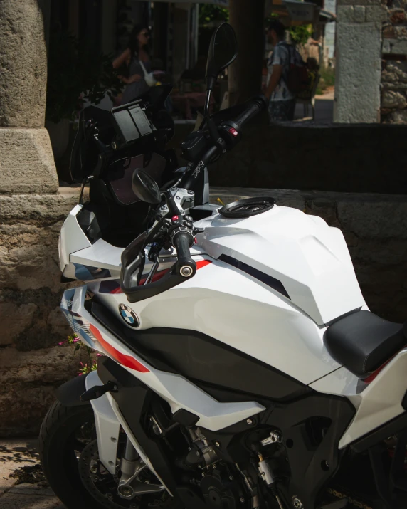 a motorcycle with a helmet on it and sunglasses strapped to the seat