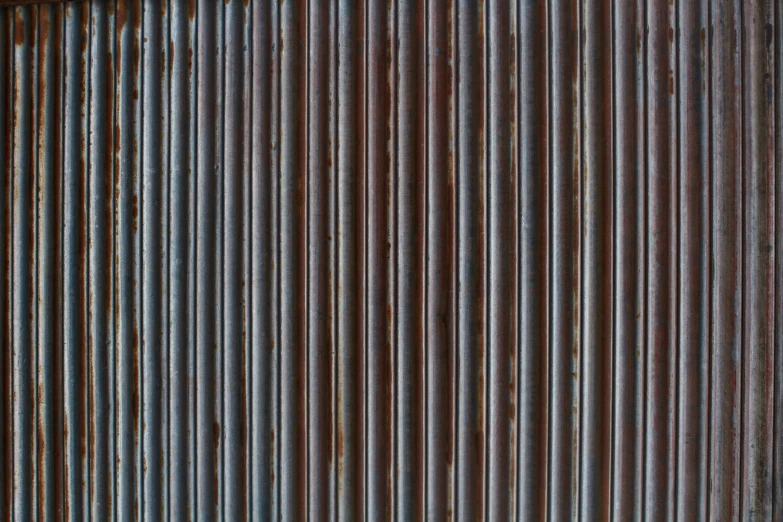 the brown and blue stripes on the back of the corrugated sheet