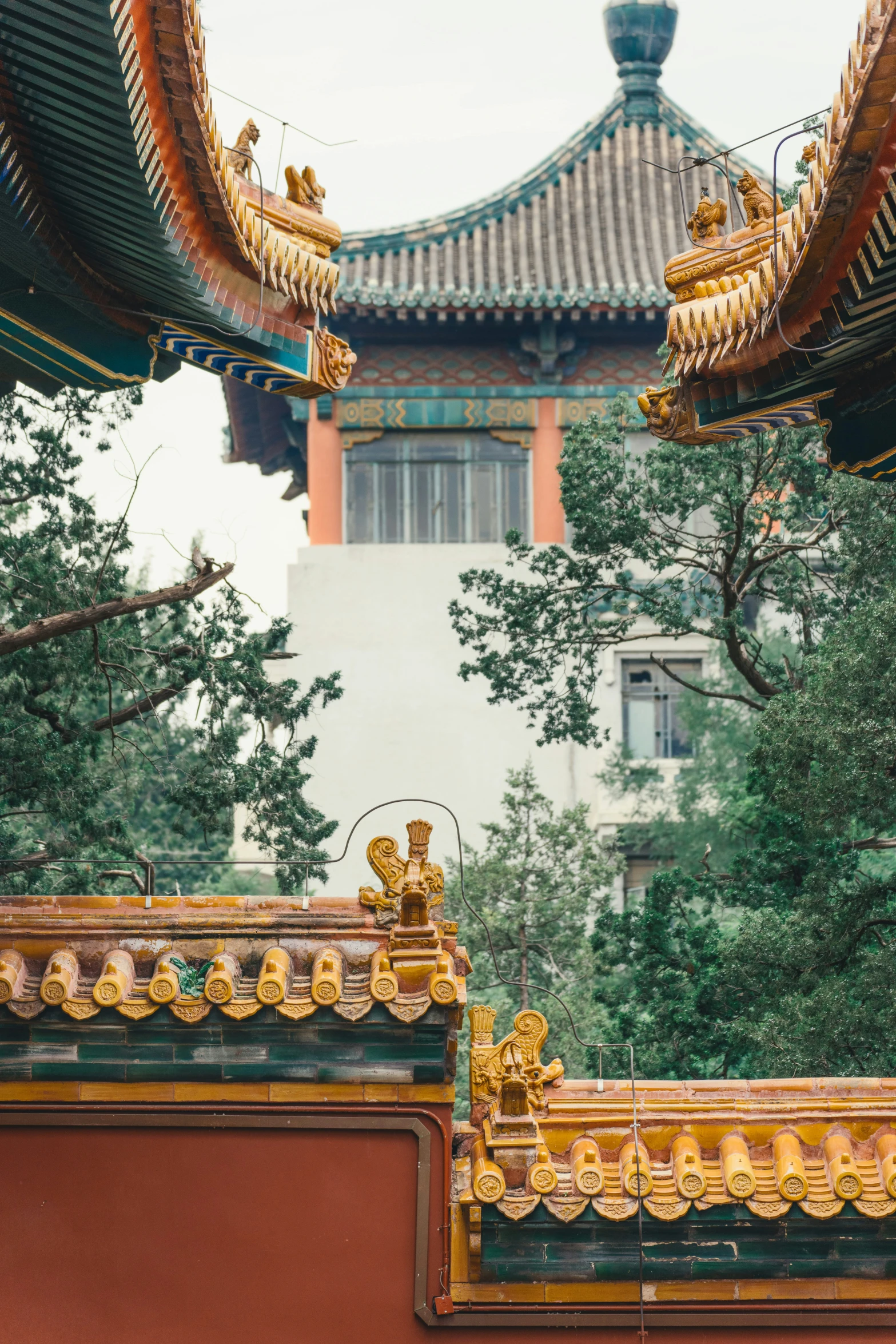 a building with a steeple covered in chinese designs