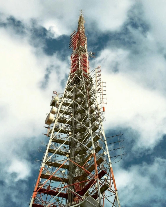 a very tall tower sitting under the clouds