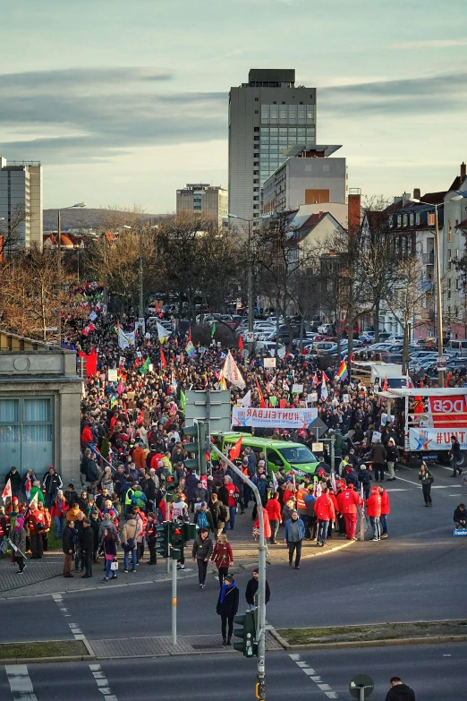 an image of a large crowd gathered at the intersection