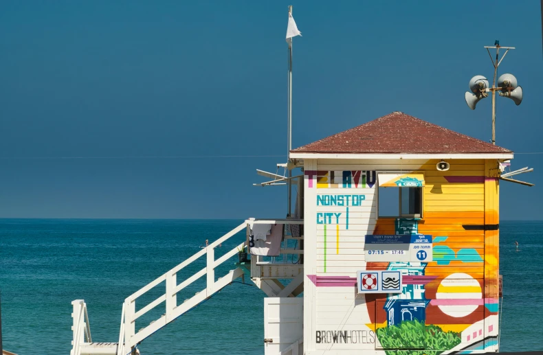 there is a life guard house that has been painted