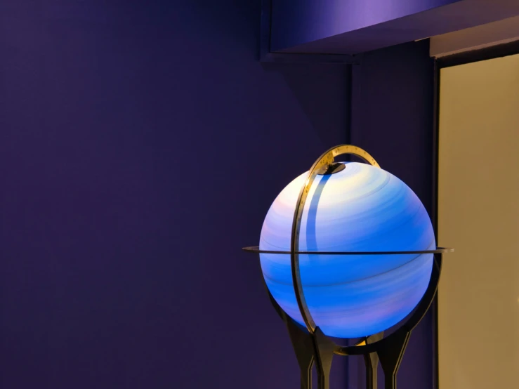 a blue and white light with a metal stand