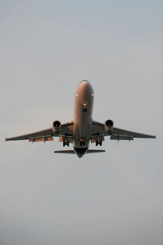 a large airplane is flying through the air