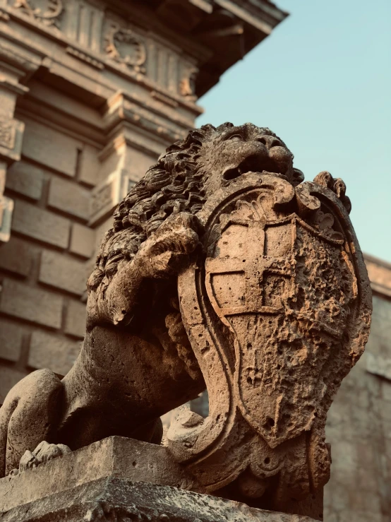 a gargoyle guarding a very ornate building