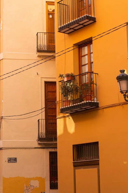 two buildings with some windows and a light in the middle